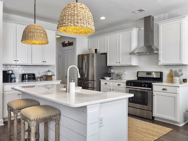 3381 Stockdale St, Mount Pleasant, SC 29466 - kitchen featuring stainless steel appliances, wall chimney range hood, white cabinets, and recessed lighting