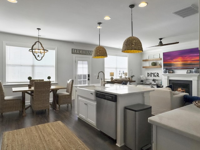 3381 Stockdale St, Mount Pleasant, SC 29466 - kitchen featuring stainless steel dishwasher, light countertops, recessed lighting, a sink, and a warm lit fireplace
