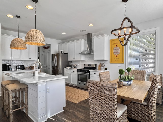 3381 Stockdale St, Mount Pleasant, SC 29466 - kitchen featuring appliances with stainless steel finishes, wall chimney exhaust hood, dark wood-type flooring, a sink, and recessed lighting