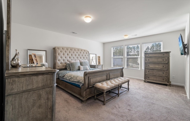 bedroom featuring light colored carpet