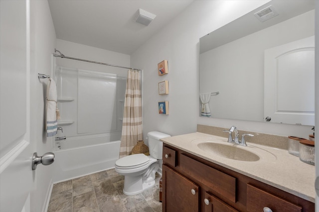 full bathroom with vanity, shower / tub combo, and toilet