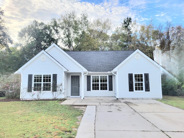 ranch-style home with a front lawn