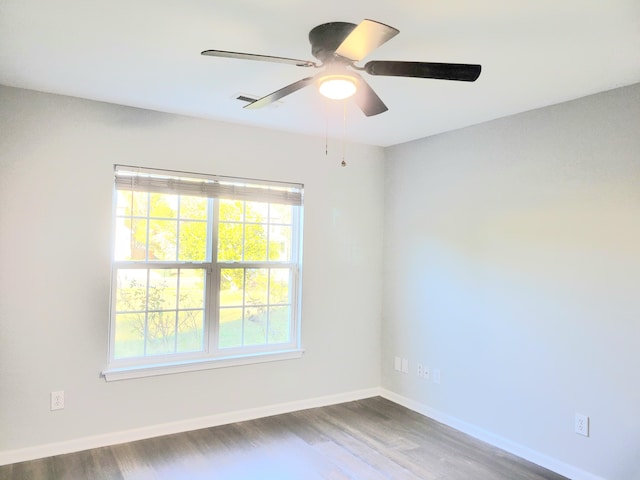 unfurnished room with hardwood / wood-style floors and ceiling fan