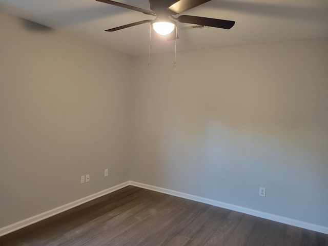 unfurnished room with dark hardwood / wood-style floors and ceiling fan