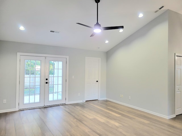 spare room featuring ceiling fan, light hardwood / wood-style flooring, and french doors