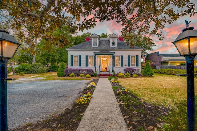 view of front of home with a yard