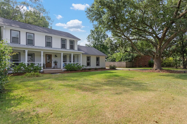 view of front of house with covered porch and a front yard