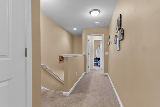 corridor with light colored carpet