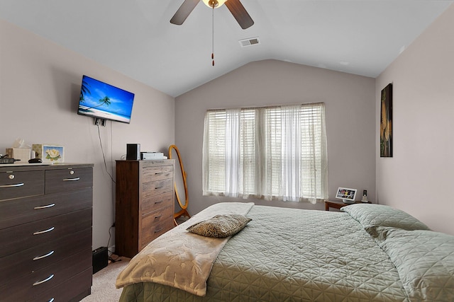 carpeted bedroom featuring vaulted ceiling and ceiling fan