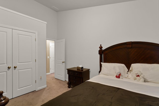 carpeted bedroom featuring a closet