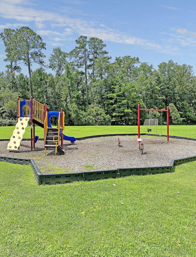 view of play area featuring a lawn