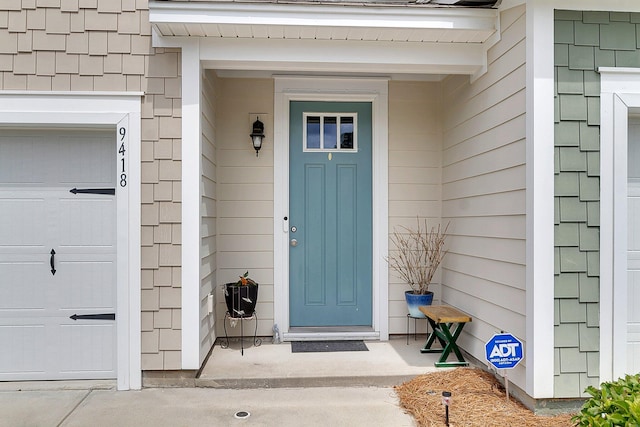 entrance to property featuring a garage