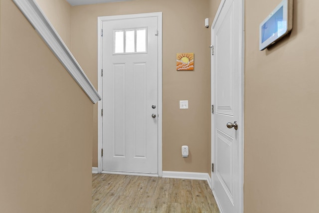 entrance foyer with light hardwood / wood-style flooring