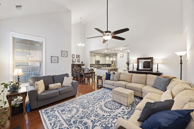 living room with ceiling fan, sink, high vaulted ceiling, and dark hardwood / wood-style floors