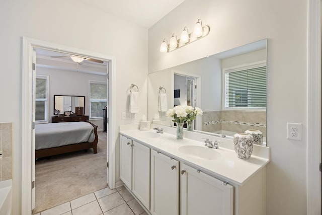 bathroom with tile patterned flooring, ceiling fan, and vanity