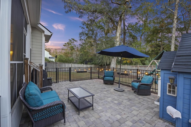 patio terrace at dusk with an outdoor hangout area