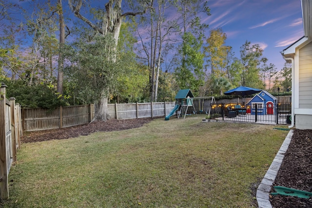 yard at dusk with a playground