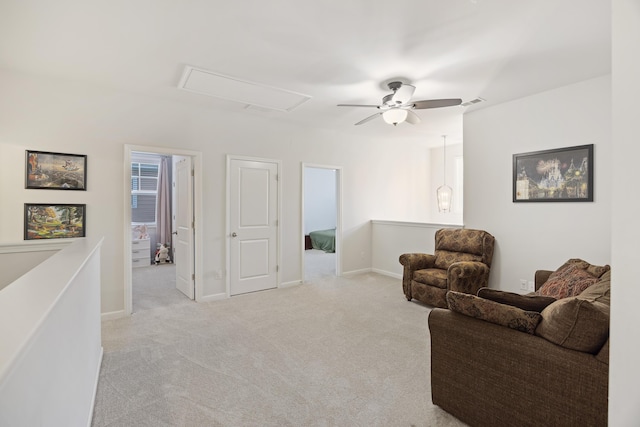 living room featuring ceiling fan and light carpet