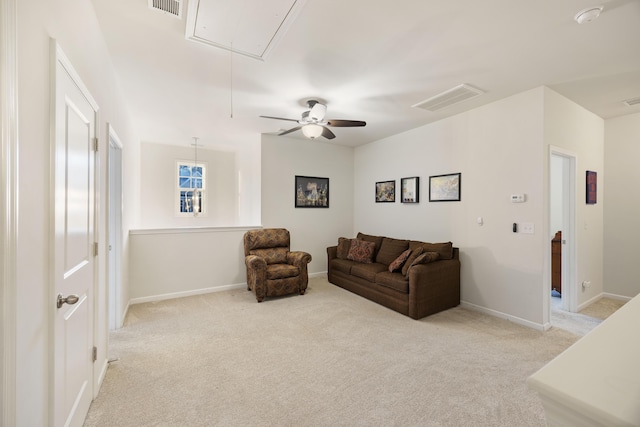 carpeted living room featuring ceiling fan