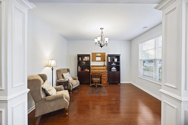 office featuring dark hardwood / wood-style flooring and a chandelier