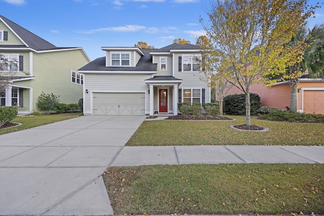 view of front of house with a garage and a front yard