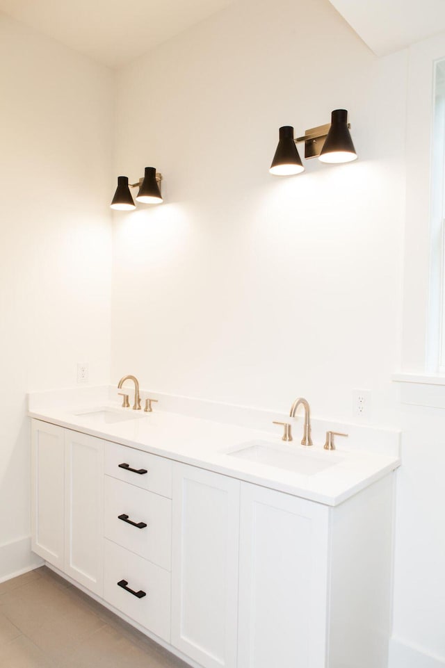 bathroom with double sink vanity and tile floors