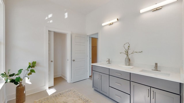 bathroom featuring tile flooring and double vanity