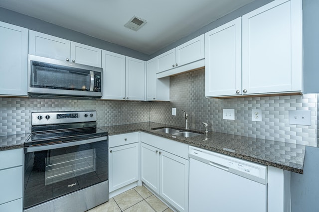 kitchen featuring white cabinetry and appliances with stainless steel finishes