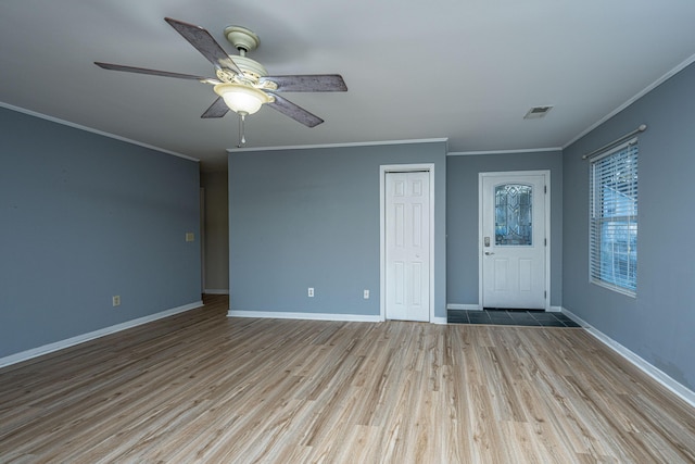 interior space featuring ceiling fan, light hardwood / wood-style floors, and ornamental molding