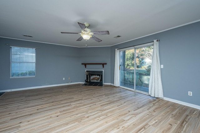 unfurnished living room with ceiling fan, ornamental molding, and light hardwood / wood-style flooring