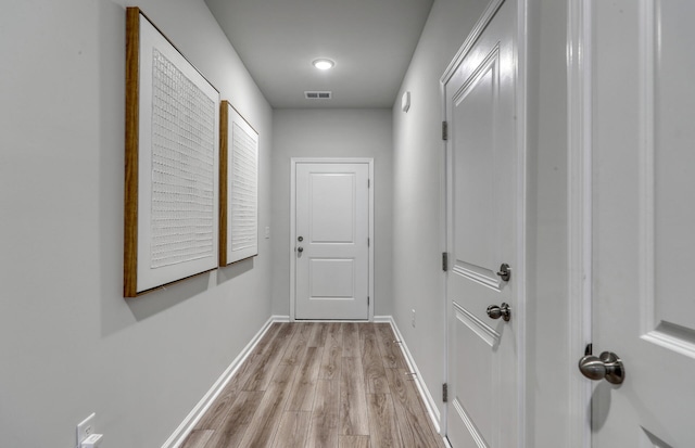 hall with light hardwood / wood-style floors