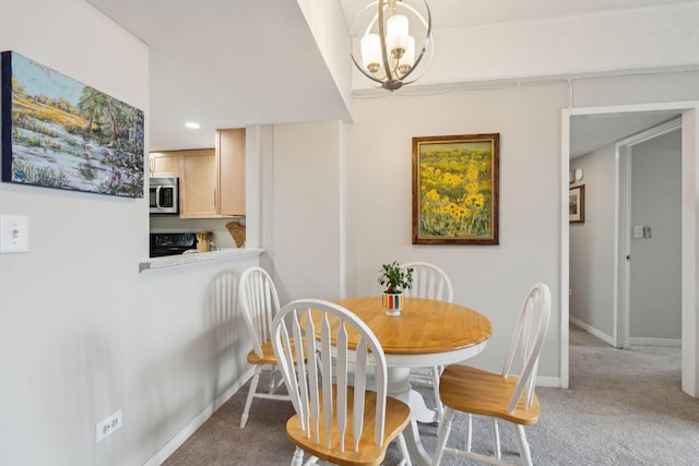 carpeted dining room featuring a notable chandelier, recessed lighting, and baseboards