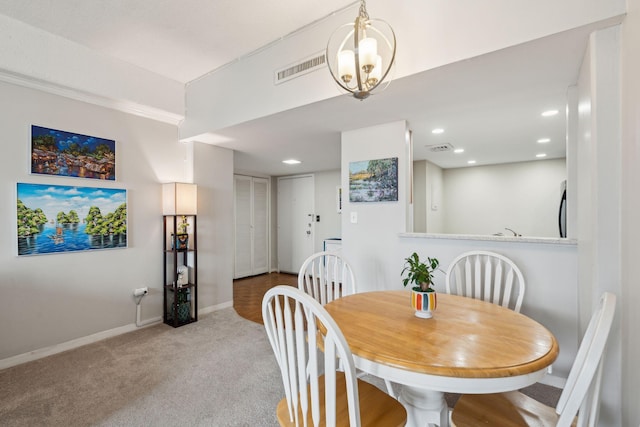 dining space with recessed lighting, light carpet, visible vents, and baseboards