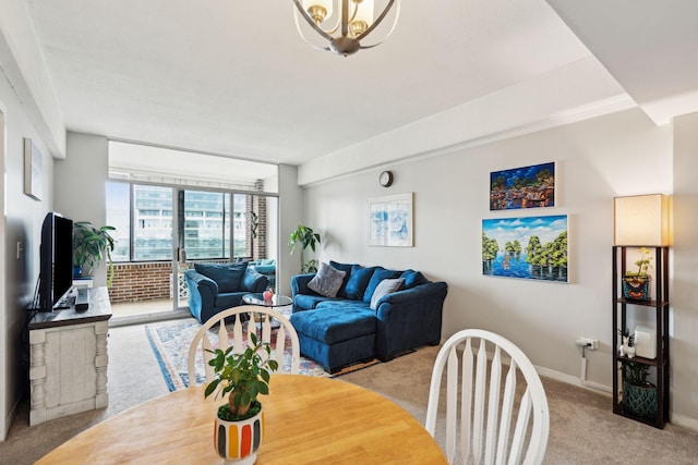 living area featuring light carpet, a chandelier, and baseboards