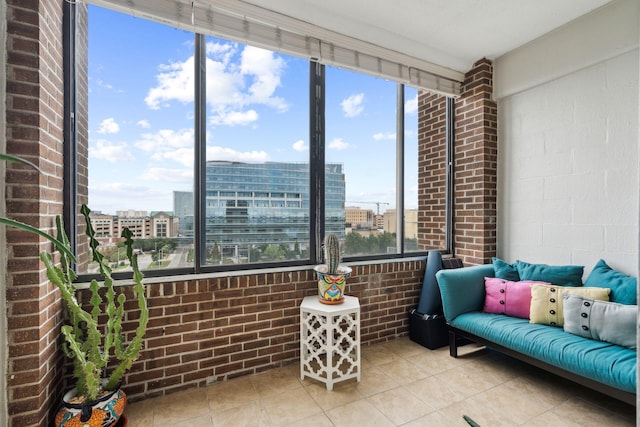 sunroom / solarium featuring a view of city