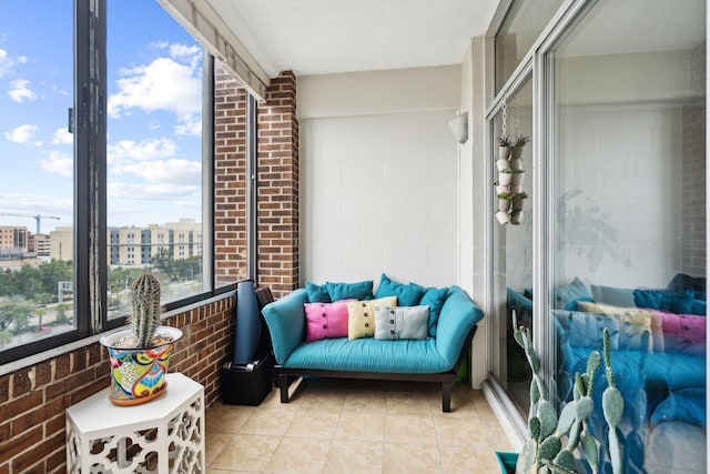 sunroom / solarium featuring a view of city