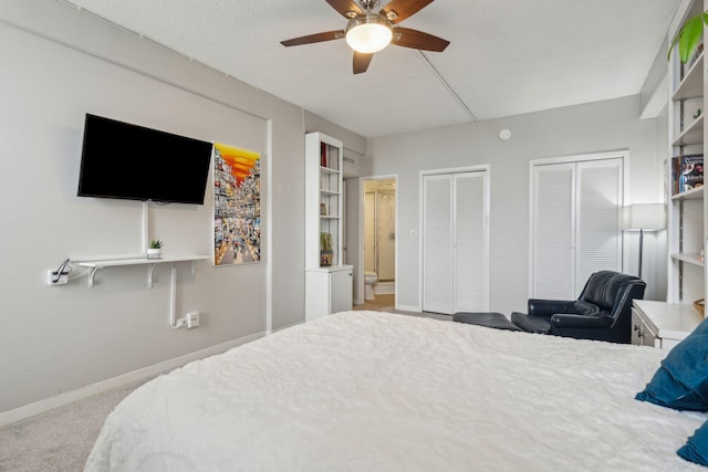 bedroom featuring multiple closets, light carpet, baseboards, and a ceiling fan