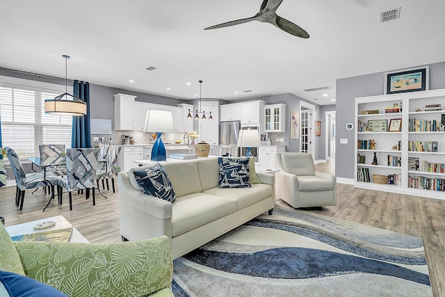 554 Tidewater Chase Ln, Summerville, SC 29486 - living area featuring light wood-style floors, ceiling fan, and recessed lighting