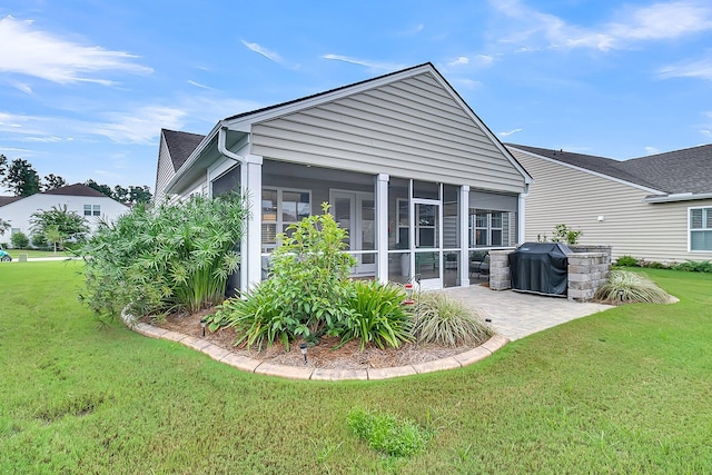 554 Tidewater Chase Ln, Summerville, SC 29486 - rear view of house with a sunroom, a lawn, and a patio