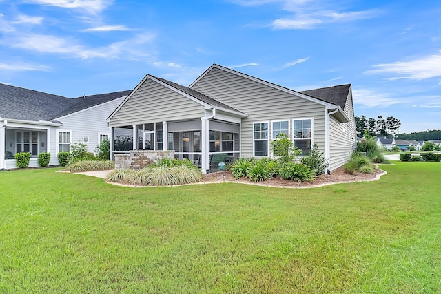554 Tidewater Chase Ln, Summerville, SC 29486 - rear view of house featuring a sunroom, a yard, and roof with shingles