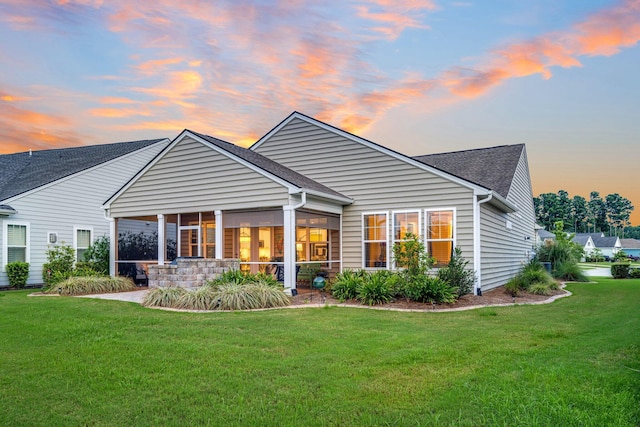 554 Tidewater Chase Ln, Summerville, SC 29486 - back of house with a yard, a sunroom, and roof with shingles