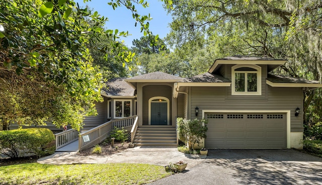 2938 Old Drake Dr, Seabrook Island, SC 29455 - view of front facade with asphalt driveway, roof with shingles, and an attached garage
