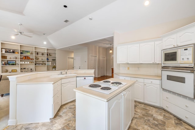 2938 Old Drake Dr, Seabrook Island, SC 29455 - kitchen with white appliances, a kitchen island, a ceiling fan, open floor plan, and lofted ceiling