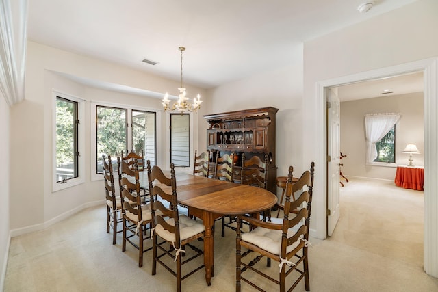 2938 Old Drake Dr, Seabrook Island, SC 29455 - dining space featuring light colored carpet, a chandelier, and plenty of natural light