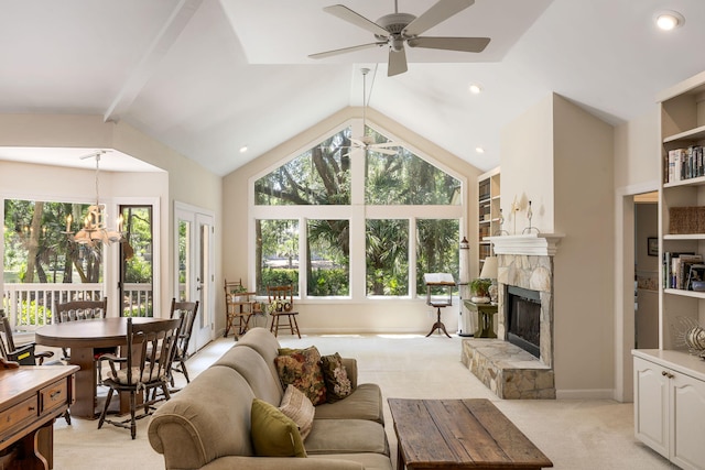 2938 Old Drake Dr, Seabrook Island, SC 29455 - living area with a ceiling fan, light colored carpet, lofted ceiling, a stone fireplace, and a chandelier