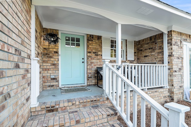 1393 Secessionville Rd, Charleston, SC 29412 - doorway to property featuring brick siding and covered porch