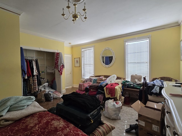 carpeted bedroom with multiple windows, crown molding, a closet, and an inviting chandelier