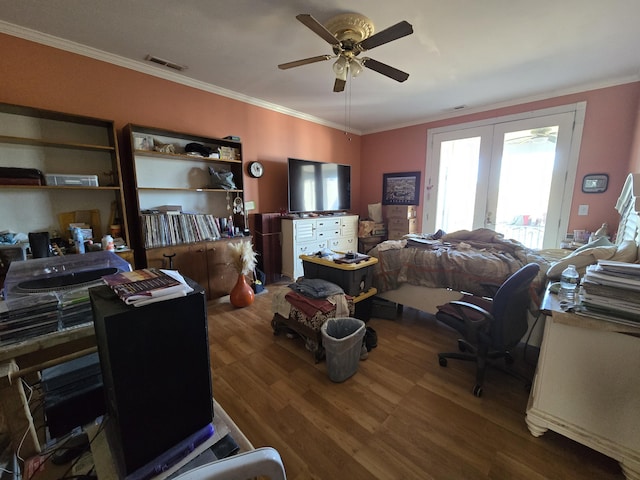 interior space featuring wood-type flooring, french doors, ceiling fan, and ornamental molding