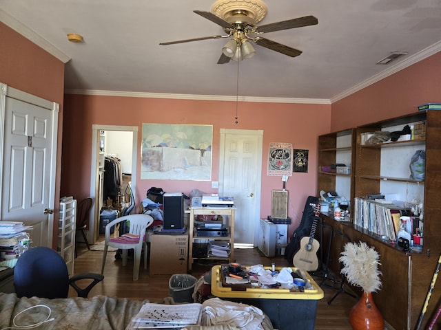 living room featuring ceiling fan, dark hardwood / wood-style flooring, and ornamental molding