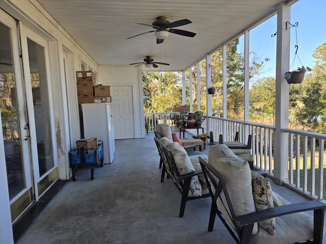 sunroom with plenty of natural light and ceiling fan